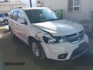 2014 Dodge Journey SXT with VIN 3C4PDCBGXET122969, listed as a IAAI auction lot 41741679 with 151,285 mi miles. Bid and sale history available at carsss.com. Image 1.