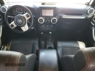 2012 Jeep Wrangler Arctic z VIN 1C4AJWBGXCL156600, wystawiony jako Copart lot #56369065 z przebiegiem 216 808 mil mil oraz Szkoda całkowita • Salvage title. Historia ofert i sprzedaży dostępna na DreamBid. Obrazek 8.