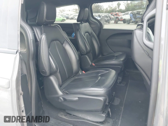 2023 Chrysler Pacifica Hybrid Touring L with VIN 2C4RC1L71PR584485, listed as a IAAI auction lot 42056423 with 58,955 mi miles and . Bid and sale history available at DreamBid. Image 8.