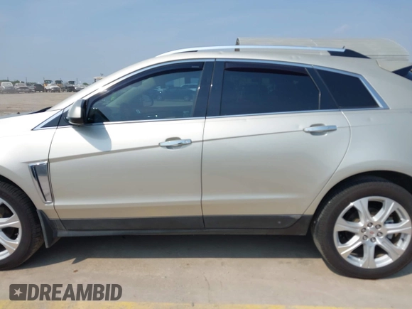 2015 Cadillac SRX Premium Collection with VIN 3GYFNDE38FS561936, listed as a IAAI auction lot 42266801 with 64,820 mi miles and . Bid and sale history available at DreamBid. Image 14.
