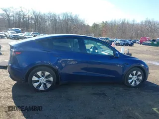 2021 Tesla Model Y Long Range with VIN 5YJYGDEE8MF293230, listed as a IAAI auction lot 41744033 with 56,797 mi miles and . Bid and sale history available at DreamBid. Image 13.