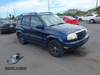 2003 Suzuki Grand Vitara z VIN JS3TE62VX34101877, wystawiony jako IAAI lot #42360315 z przebiegiem 171 207 mil mil oraz . Historia ofert i sprzedaży dostępna na DreamBid. Obrazek 1.
