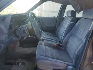 1992 Plymouth Acclaim z VIN 1P3XA46K8NF255561, wystawiony jako Copart lot #74290964 z przebiegiem 126 154 mil mil oraz Szkody całkowita. Historia ofert i sprzedaży dostępna na DreamBid. Obrazek 7.