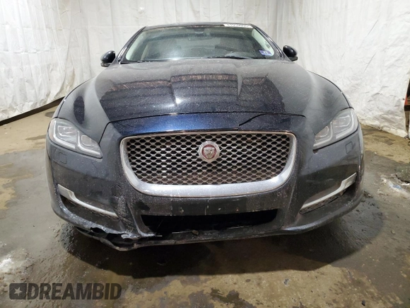 2016 Jaguar XJ with VIN SAJXJ1GD2G8V98776, listed as a Copart auction lot 41959995 with 77,391 mi miles and Salvage title. Bid and sale history available at DreamBid. Image 5.