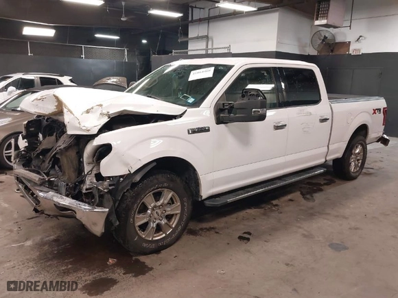 2015 Ford F-150 XLT w/HD Payload Pkg with VIN 1FTFW1EF8FKF09732, listed as a IAAI auction lot 41064468 with 105,340 mi miles. Bid and sale history available at carsss.com. Image 2.