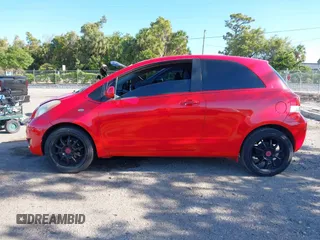 2009 Toyota Yaris with VIN JTDJT903695234623, listed as a IAAI auction lot 42027852 with 146,000 mi miles. Bid and sale history available at carsss.com. Image 14.