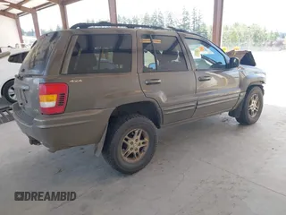 1999 Jeep Grand Cherokee Limited z VIN 1J4GW68N0XC512229, wystawiony jako IAAI lot #42189815 z przebiegiem 230 028 mil mil oraz . Historia ofert i sprzedaży dostępna na DreamBid. Obrazek 4.