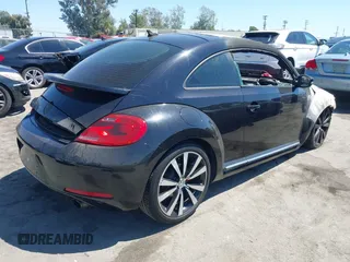 2012 Volkswagen Beetle 2.0T Black Turbo Launch Edition PZEV with VIN 3VWVA7AT1CM660177, listed as a IAAI auction lot 40282938 with 1 mi miles. Bid and sale history available at carsss.com. Image 4.