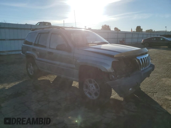 1999 Jeep Grand Cherokee Laredo with VIN 1J4GW58NXXC747537, listed as a Copart auction lot 87310234 with Not provided miles and Salvage title. Bid and sale history available at DreamBid. Image 4.