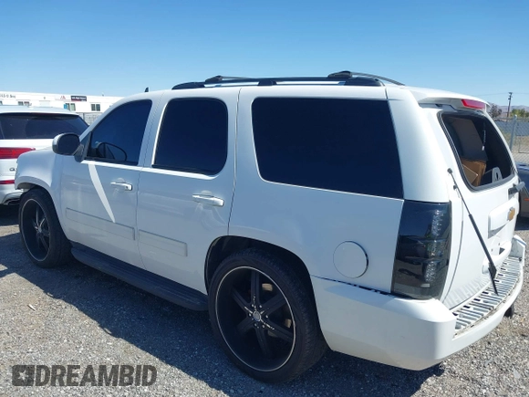 2012 Chevrolet Tahoe LS with VIN 1GNSCAE06CR141256, listed as a IAAI auction lot 41806708 with 105,984 mi miles and . Bid and sale history available at DreamBid. Image 3.