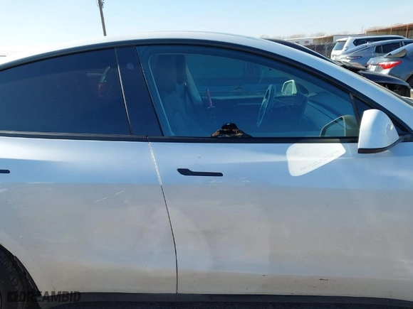 2023 Tesla Model Y Long Range with VIN 7SAYGAEEXPF598086, listed as a IAAI auction lot 41125984 with NaN miles. Bid and sale history available at carsss.com. Image 13.