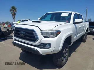2021 Toyota Tacoma 4WD SR5 with VIN 3TMDZ5BN4MM106693, listed as a IAAI auction lot 41986838 with 52,510 mi miles. Bid and sale history available at carsss.com. Image 2.