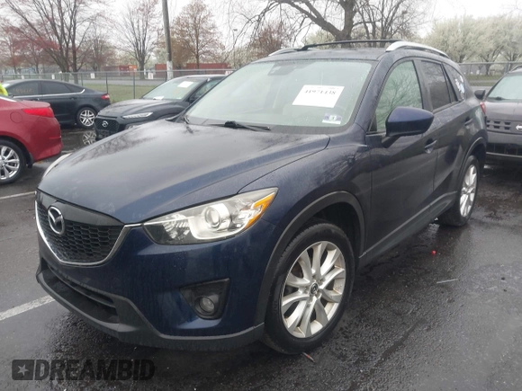 2014 Mazda CX-5 Grand Touring with VIN JM3KE4DY8E0366644, listed as a IAAI auction lot 41971438 with 135,644 mi miles and . Bid and sale history available at carsss.com. Image 2.