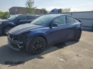 2022 Tesla Model Y Long Range z VIN 7SAYGDEE7NF335827, wystawiony jako Copart lot #54890875 z przebiegiem 63 738 mil mil oraz Szkoda całkowita • Salvage title. Historia ofert i sprzedaży dostępna na DreamBid. Obrazek 1.