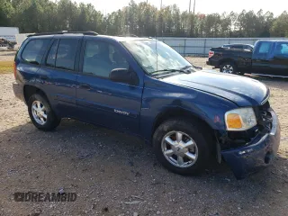 2005 GMC Envoy SLE with VIN 1GKDS13S352369384, listed as a Copart auction lot 79996394 with 117,697 mi miles and Salvage Title. Bid and sale history available at carsss.com. Image 4.