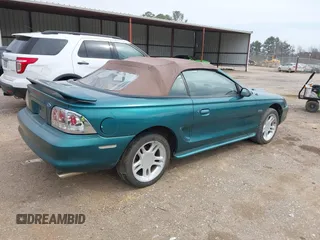 1996 Ford Mustang GT with VIN 1FALP45X7TF129303, listed as a IAAI auction lot 41698238 with 130,181 mi miles. Bid and sale history available at carsss.com. Image 4.