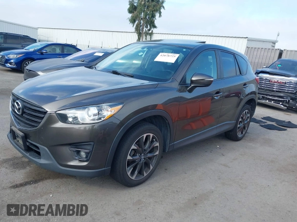 2016 Mazda CX-5 Grand Touring z VIN JM3KE4DY2G0684066, wystawiony jako IAAI lot #42078725 z przebiegiem 200 129 mil mil oraz . Historia ofert i sprzedaży dostępna na DreamBid. Obrazek 17.