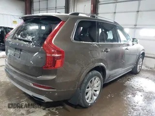 2016 Volvo XC90 T6 Momentum with VIN YV4A22PK6G1022376, listed as a IAAI auction lot 41595150 with 128,877 mi miles. Bid and sale history available at carsss.com. Image 4.