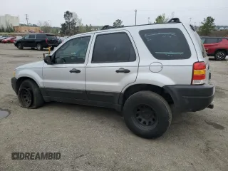 2003 Ford Escape XLS Popular with VIN 1FMYU02173KB43156, listed as a Copart auction lot 51534495 with 266,600 mi miles and Salvage title. Bid and sale history available at DreamBid. Image 2.