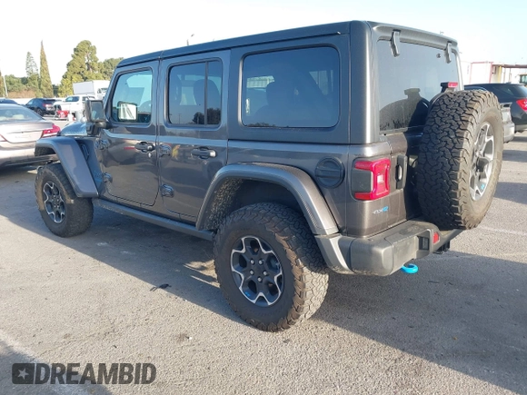 2023 Jeep Wrangler Rubicon with VIN 1C4JJXR67PW662277, listed as a IAAI auction lot 41950065 with 35,714 mi miles and . Bid and sale history available at DreamBid. Image 3.
