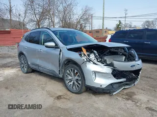 2020 Ford Escape Titanium Hybrid z VIN 1FMCU9DZ9LUB87634, wystawiony jako IAAI lot #41968983 z przebiegiem 57 478 mil mil oraz . Historia ofert i sprzedaży dostępna na DreamBid. Obrazek 1.