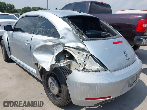 2013 Volkswagen Beetle 2.5L with VIN 3VWJX7AT7DM673319, listed as a IAAI auction lot 42169554 with 128,622 mi miles and . Bid and sale history available at DreamBid. Image 3.