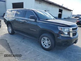 2017 Chevrolet Suburban LS with VIN 1GNSCGECXHR351539, listed as a Copart auction lot 87070214 with 246,129 mi miles and Salvage title. Bid and sale history available at DreamBid. Image 4.