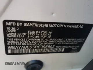 2013 BMW 7 Series 750i with VIN WBAYA8C55DC996693, listed as a Copart auction lot 80233423 with 140,925 mi miles and Salvage Title. Bid and sale history available at DreamBid. Image 13.