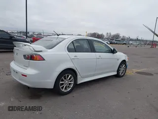 2016 Mitsubishi Lancer SE with VIN JA32V2FWXGU003619, listed as a IAAI auction lot 41041665 with 98,627 mi miles. Bid and sale history available at carsss.com. Image 4.