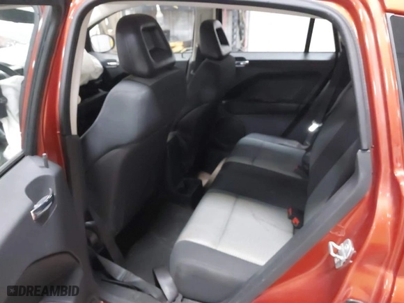 2009 Dodge Caliber SXT with VIN 1B3HB48A39D233346, listed as a IAAI auction lot 41068002 with 100,306 mi miles. Bid and sale history available at carsss.com. Image 8.