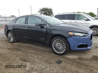 2014 Ford Fusion Titanium Hybrid z VIN 3FA6P0RU1ER118499, wystawiony jako Copart lot #58591305 z przebiegiem 252 353 mil mil oraz Szkody całkowita. Historia ofert i sprzedaży dostępna na DreamBid. Obrazek 4.