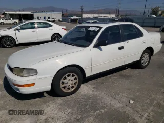 1992 Toyota Camry LE with VIN 4T1SK12E0NU077223, listed as a Copart auction lot 71787194 with 239,027 mi miles and Salvage Title. Bid and sale history available at carsss.com. Image 1.