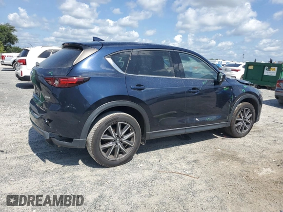 2018 Mazda CX-5 Grand Touring with VIN JM3KFADM1J1387297, listed as a Copart auction lot 60589625 with 92,283 mi miles and Non repairable. Bid and sale history available at DreamBid. Image 3.