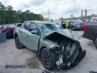 2022 Hyundai Santa Cruz SEL z VIN 5NTJB4AE8NH002297, wystawiony jako IAAI lot #42096641 z przebiegiem Nie podano mil oraz . Historia ofert i sprzedaży dostępna na DreamBid. Obrazek 1.