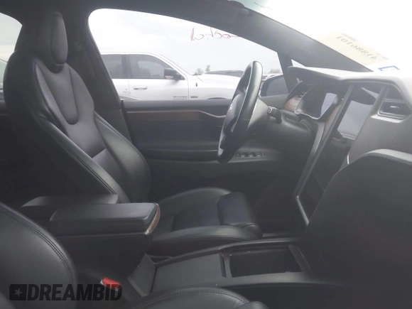 2021 Tesla Model X Long Range Plus with VIN 5YJXCAE27MF324270, listed as a IAAI auction lot 41886101 with 59,614 mi miles and . Bid and sale history available at carsss.com. Image 5.
