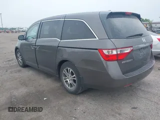 2011 Honda Odyssey EX-L with VIN 5FNRL5H64BB029087, listed as a IAAI auction lot 42508764 with 214,705 mi miles and . Bid and sale history available at DreamBid. Image 3.