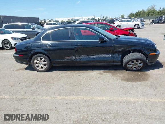 2003 Jaguar S-Type with VIN SAJEA01T13FM70486, listed as a IAAI auction lot 41989501 with 100,109 mi miles and . Bid and sale history available at DreamBid. Image 13.
