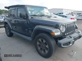 2018 Jeep Wrangler Unlimited Sahara z VIN 1C4HJXEG5JW194523, wystawiony jako IAAI lot #42056557 z przebiegiem 71 141 mil mil oraz . Historia ofert i sprzedaży dostępna na DreamBid. Obrazek 1.