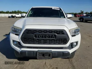 2017 Toyota Tacoma SR z VIN 5TFAX5GNXHX074690, wystawiony jako Copart lot #56672165 z przebiegiem 107 292 mil mil oraz Szkoda całkowita • Salvage title. Historia ofert i sprzedaży dostępna na DreamBid. Obrazek 5.
