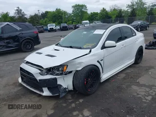 2013 Mitsubishi Lancer Evolution GSR z VIN JA32W8FV0DU023509, wystawiony jako IAAI lot #42222552 z przebiegiem 128 030 mil mil oraz . Historia ofert i sprzedaży dostępna na DreamBid. Obrazek 2.