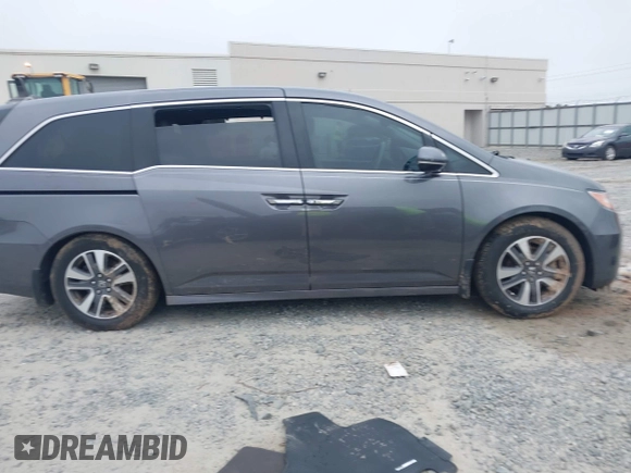 2014 Honda Odyssey Touring with VIN 5FNRL5H98EB008953, listed as a IAAI auction lot 42291179 with Not provided miles and . Bid and sale history available at DreamBid. Image 12.