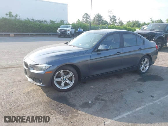 2013 BMW 3 Series 328i xDrive with VIN WBA3B3C53DJ810249, listed as a IAAI auction lot 42099473 with 125,255 mi miles. Bid and sale history available at carsss.com. Image 2.