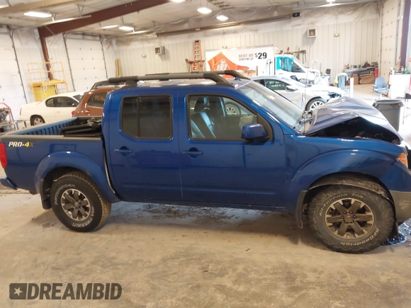 2015 Nissan Frontier SV with VIN 1N6AD0EV4FN709892, listed as a IAAI auction lot 42473594 with 153,103 mi miles and . Bid and sale history available at DreamBid. Image 13.