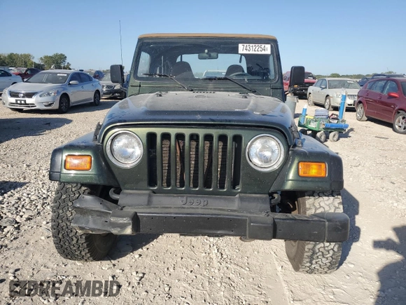 1998 Jeep Wrangler Sport with VIN 1J4FY19S0WP709843, listed as a Copart auction lot 74312254 with 147,010 mi miles and Salvage Title. Bid and sale history available at carsss.com. Image 5.