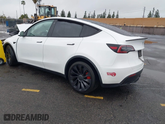 2022 Tesla Model Y Performance with VIN 7SAYGDEFXNF384268, listed as a IAAI auction lot 41558359 with 33,870 mi miles and . Bid and sale history available at DreamBid. Image 3.