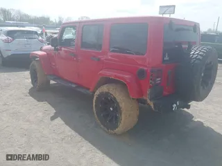 2012 Jeep Wrangler Unlimited Sahara with VIN 1C4HJWEGXCL209449, listed as a IAAI auction lot 41864432 with 100,917 mi miles. Bid and sale history available at carsss.com. Image 3.