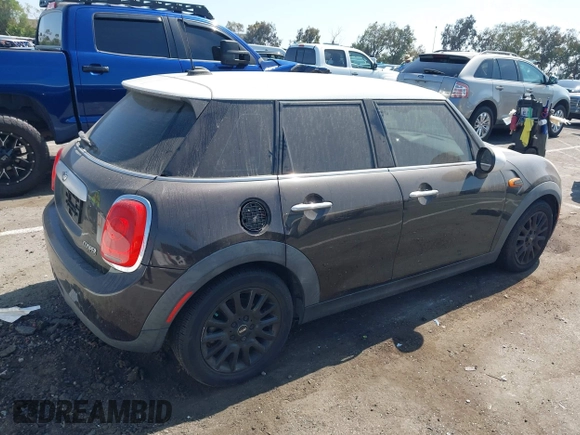 2015 MINI Hardtop 4 Door z VIN WMWXS5C55FT830653, wystawiony jako IAAI lot #42721174 z przebiegiem 126 298 mil mil oraz . Historia ofert i sprzedaży dostępna na DreamBid. Obrazek 4.