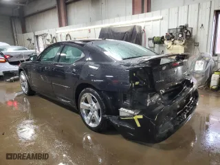 2010 Dodge Charger Road/Track with VIN 2B3CA8CT8AH288444, listed as a Copart auction lot 49392795 with 104,119 mi miles and Salvage Title. Bid and sale history available at carsss.com. Image 2.