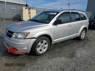 2013 Dodge Journey American Value z VIN 3C4PDCABXDT621551, wystawiony jako Copart lot #52523675 z przebiegiem 123 348 mil mil oraz Szkoda całkowita • Salvage title. Historia ofert i sprzedaży dostępna na DreamBid. Obrazek 1.