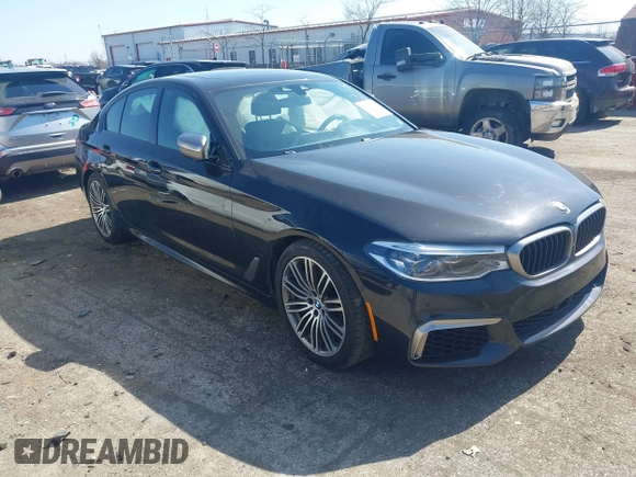 2019 BMW 5 Series M550i xDrive with VIN WBAJB9C51KB464879, listed as a IAAI auction lot 41774834 with 77,379 mi miles and . Bid and sale history available at DreamBid. Image 1.
